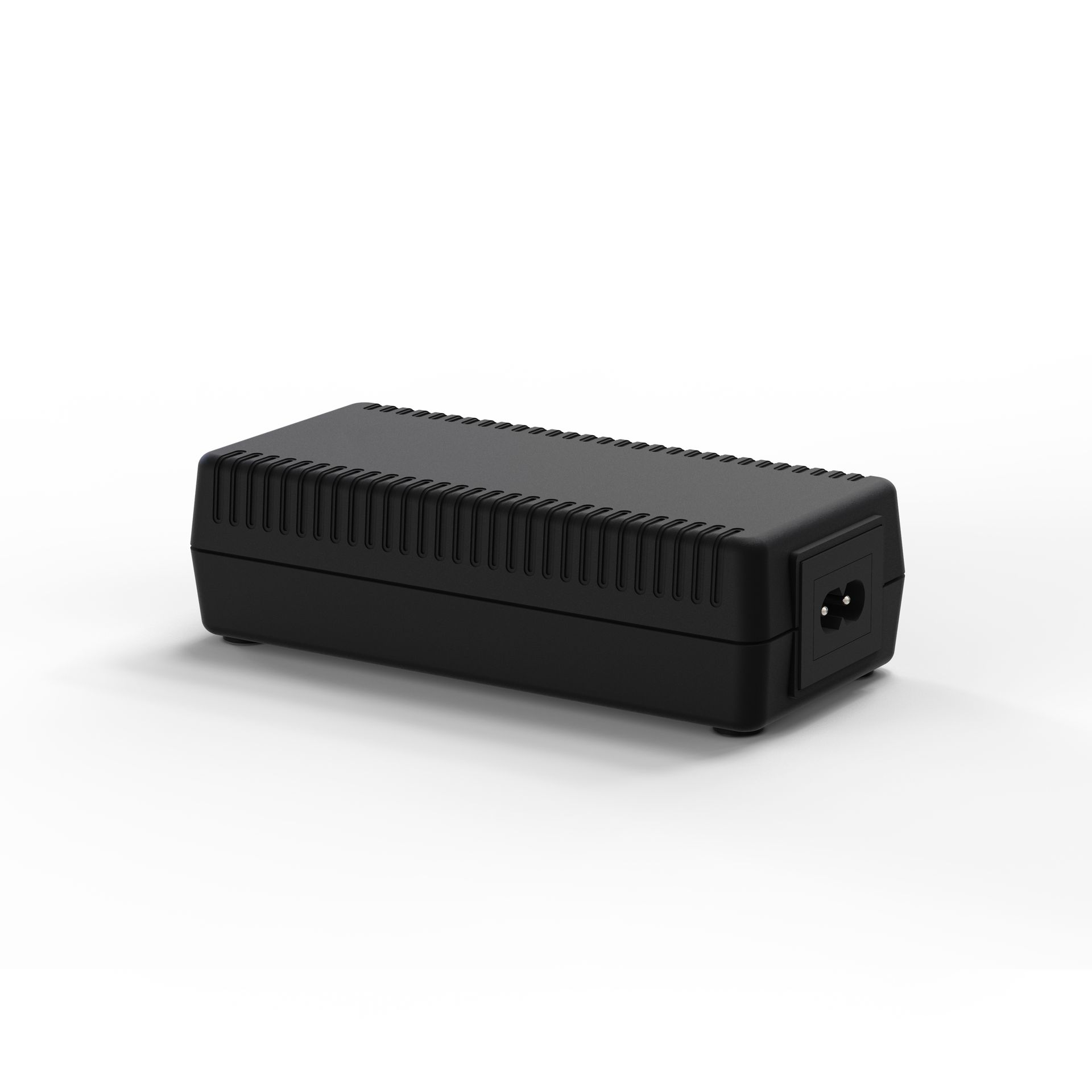 A black power supply is sitting on a white surface