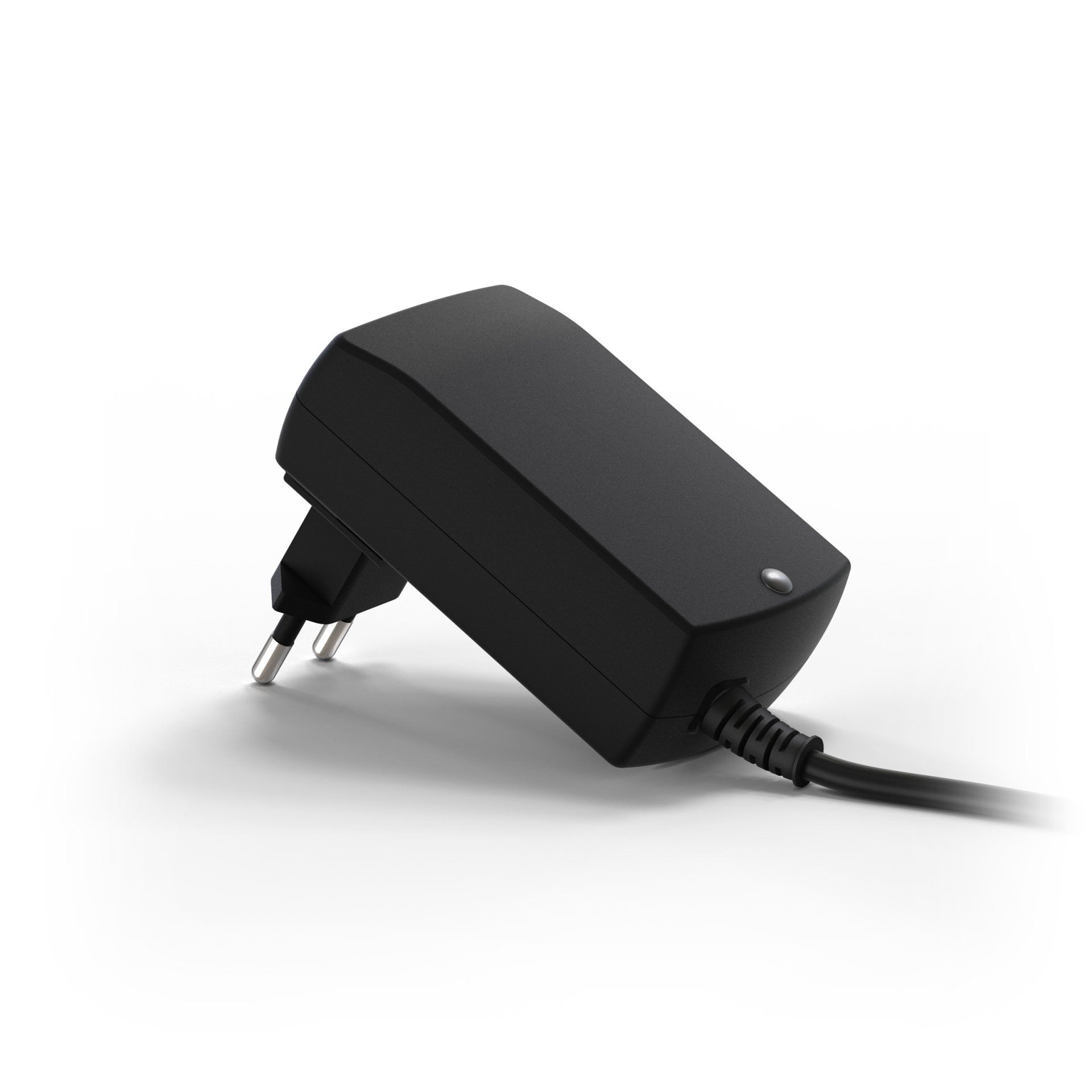 A black charger with a cord attached to it
