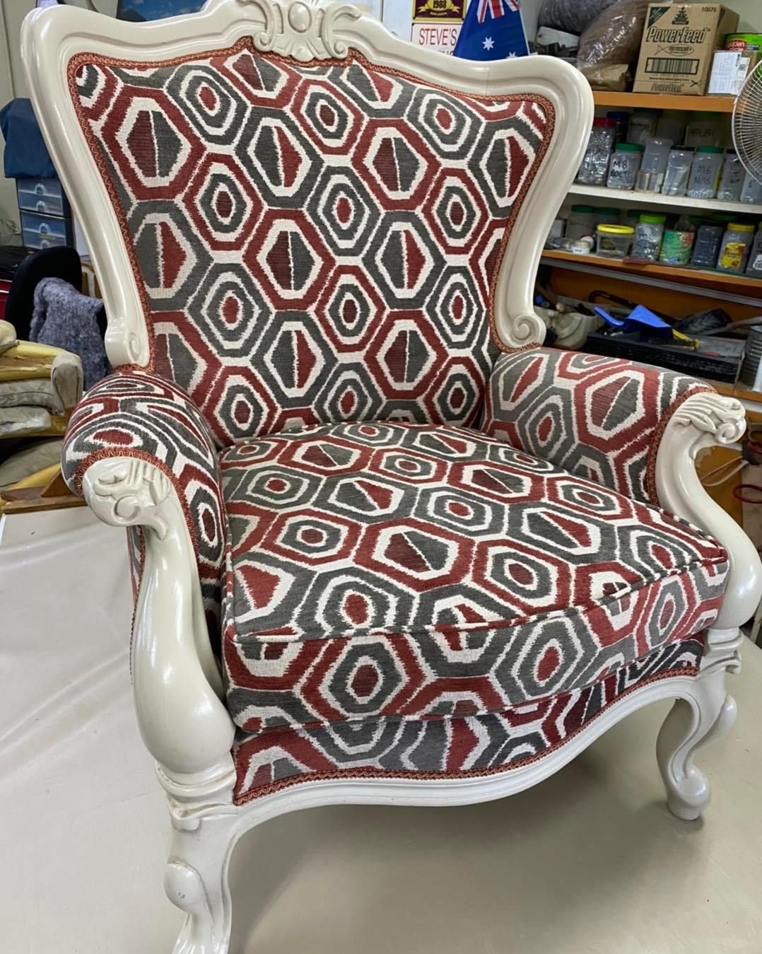 A Chair With a Pattern on It is Sitting on a Table — Aztak Upholstery In Manunda, QLD