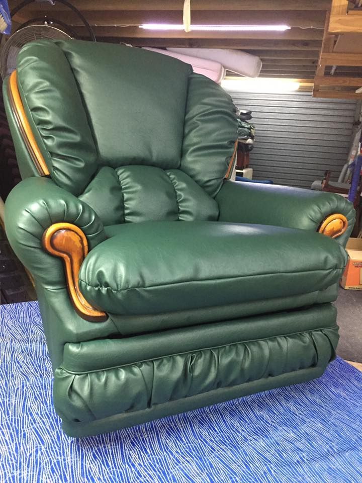 A Green Leather Recliner is Sitting on Top of a Blue Rug — Aztak Upholstery In Manunda, QLD