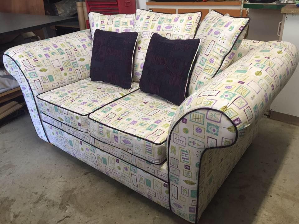 A Living Room With A White Couch And Green Pillows — Aztak Upholstery In Cairns, QLD