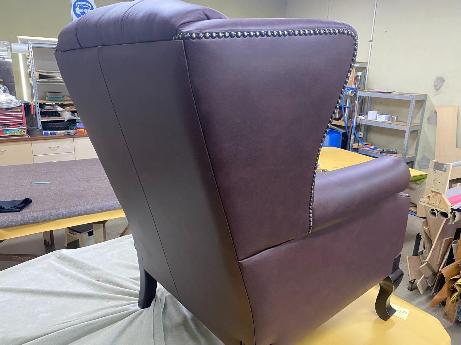 A Purple Leather Chair Is Sitting On A Table In A Room — Aztak Upholstery In Gordonvale, QLD