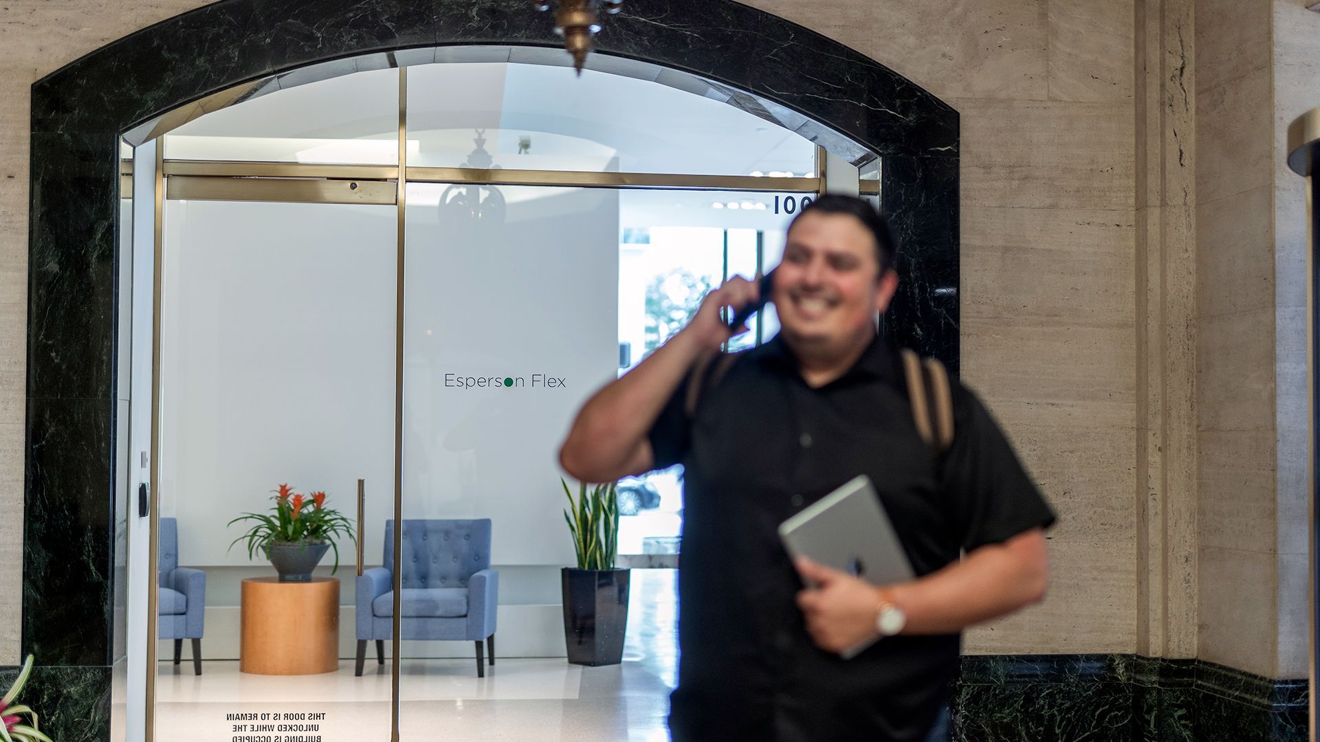 man walking into the esperson flex building
