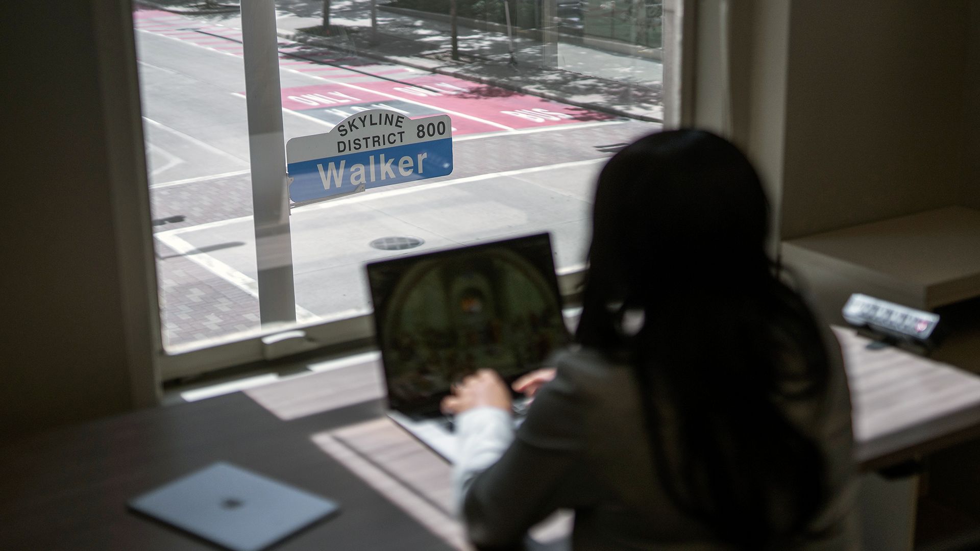 woman working in front of a window