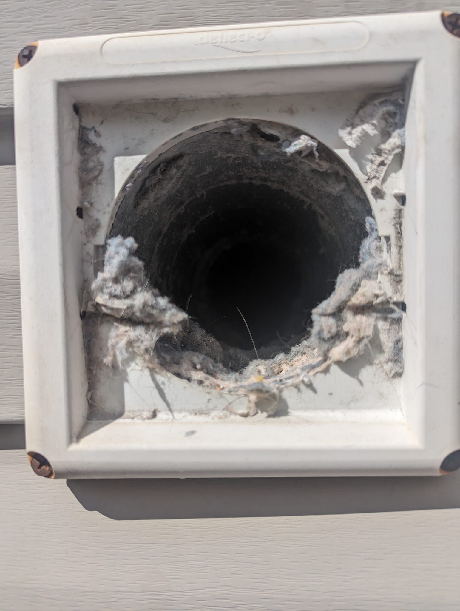 There is a hole in the wall that looks like a tunnel.