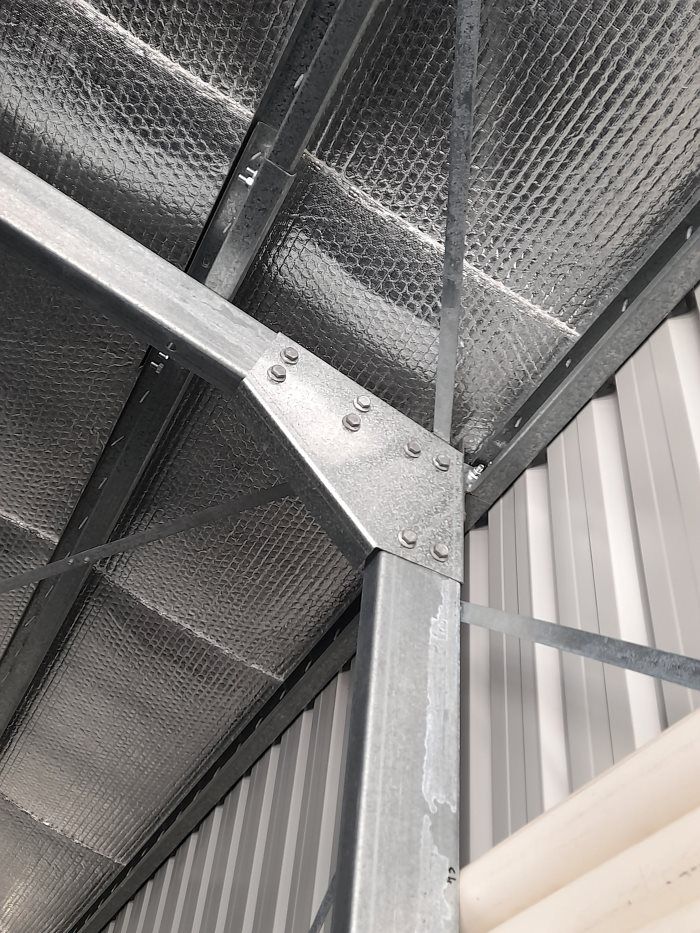 A Close Up Of A Metal Structure In A Building — Whit Coast Sheds in  Gregory River, QLD