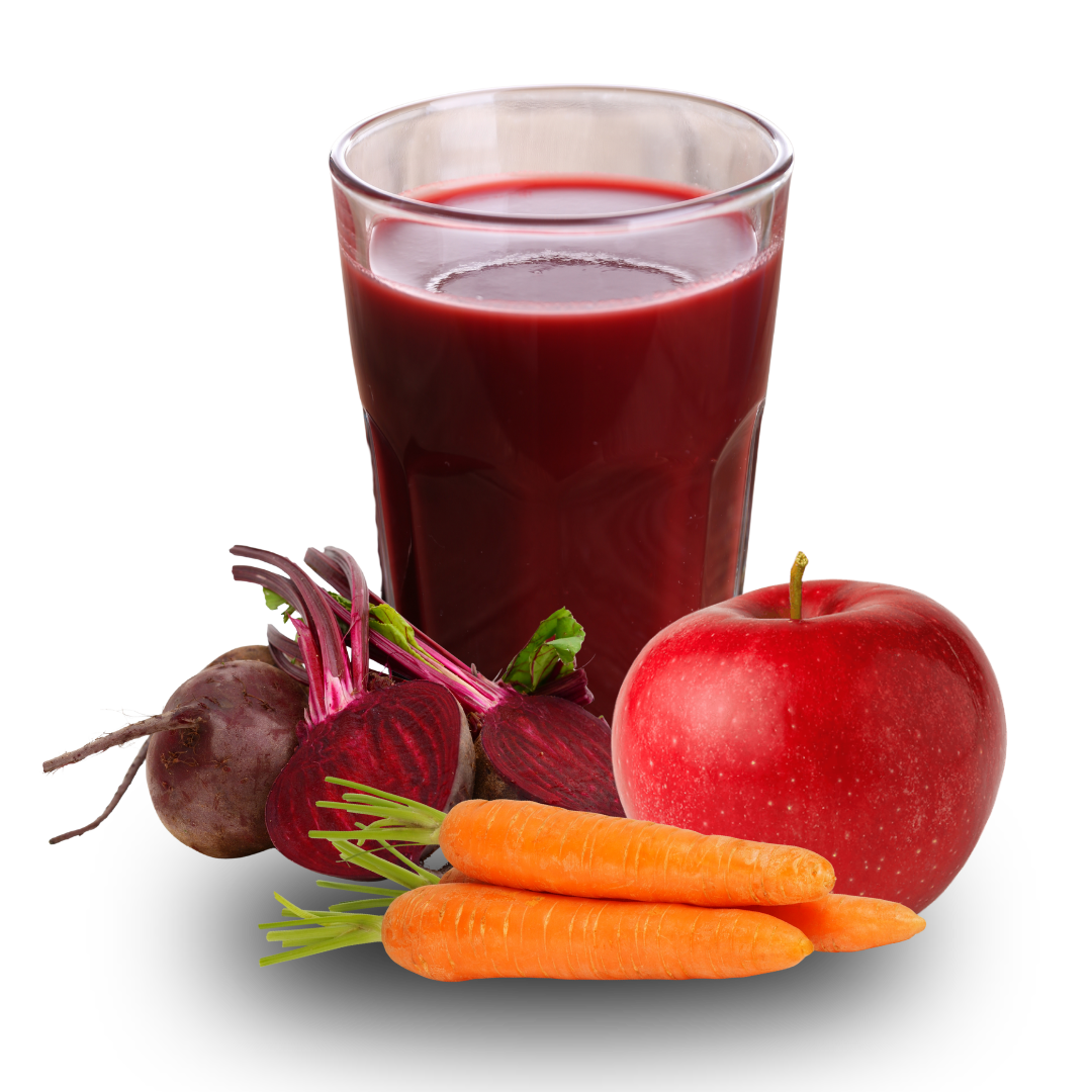 Glass of red juice with beets, carrots, and an apple.