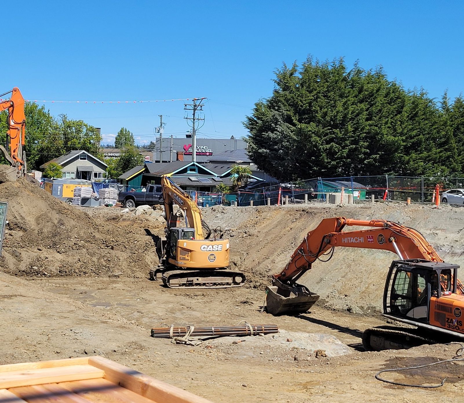 A case excavator is working on a construction site