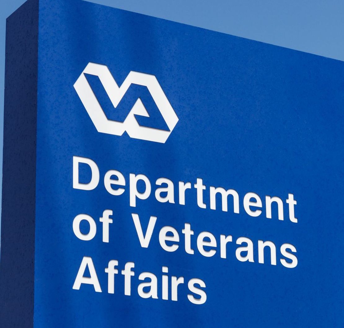 Blue sign with VA logo and the words “Department of Veterans Affairs.”