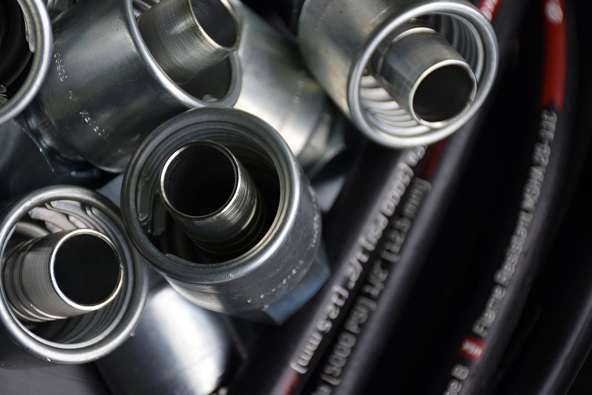 A Bunch Of Hose Metal Pipes — Action Hose & Fitting Solutions In Loganholme, QLD