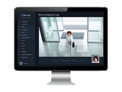 Monitor showing a person identified by facial recognition, inside a building.
