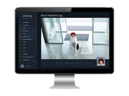 Monitor displaying surveillance footage with a person's face highlighted by a red box.