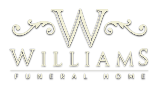 Williams Funeral Home logo with a decorative gold “W” and elegant scrollwork on a light background