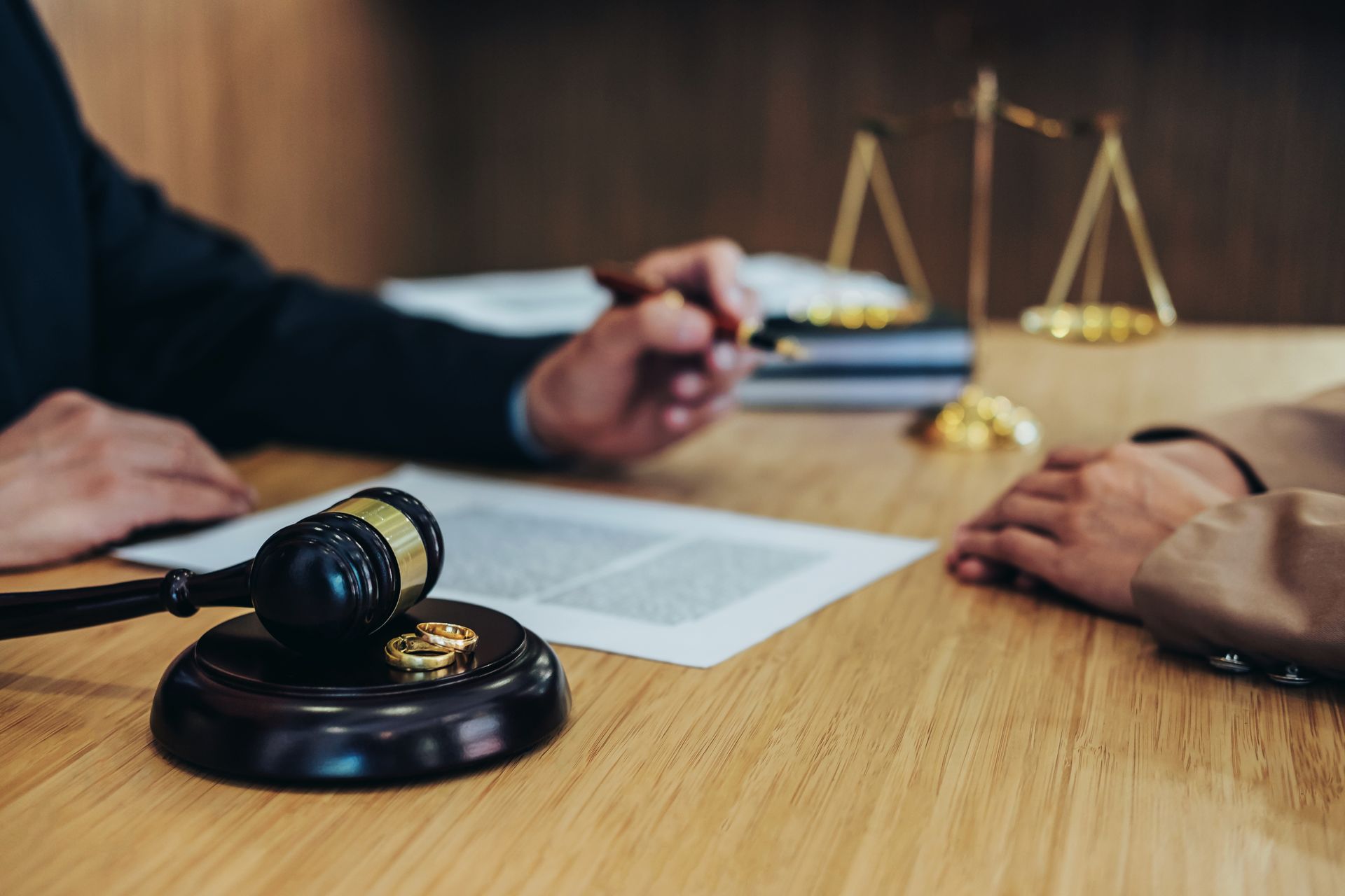Divorce Attorneys reviewing separation agreement paperwork with a client