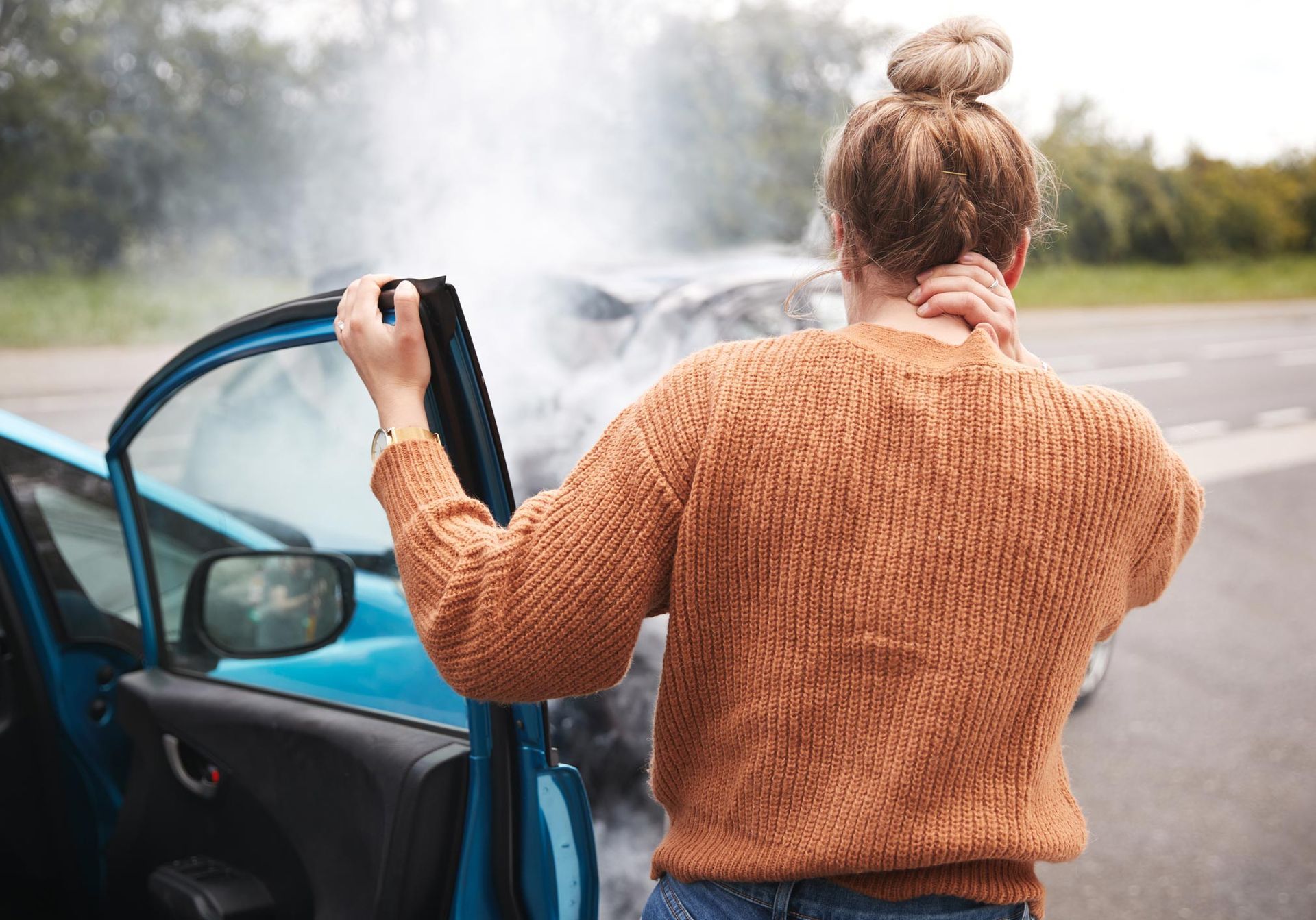 Auto Accident — Fairlawn, OH — Susan Lax Law Office Woman Holding Injured Neck After Accident