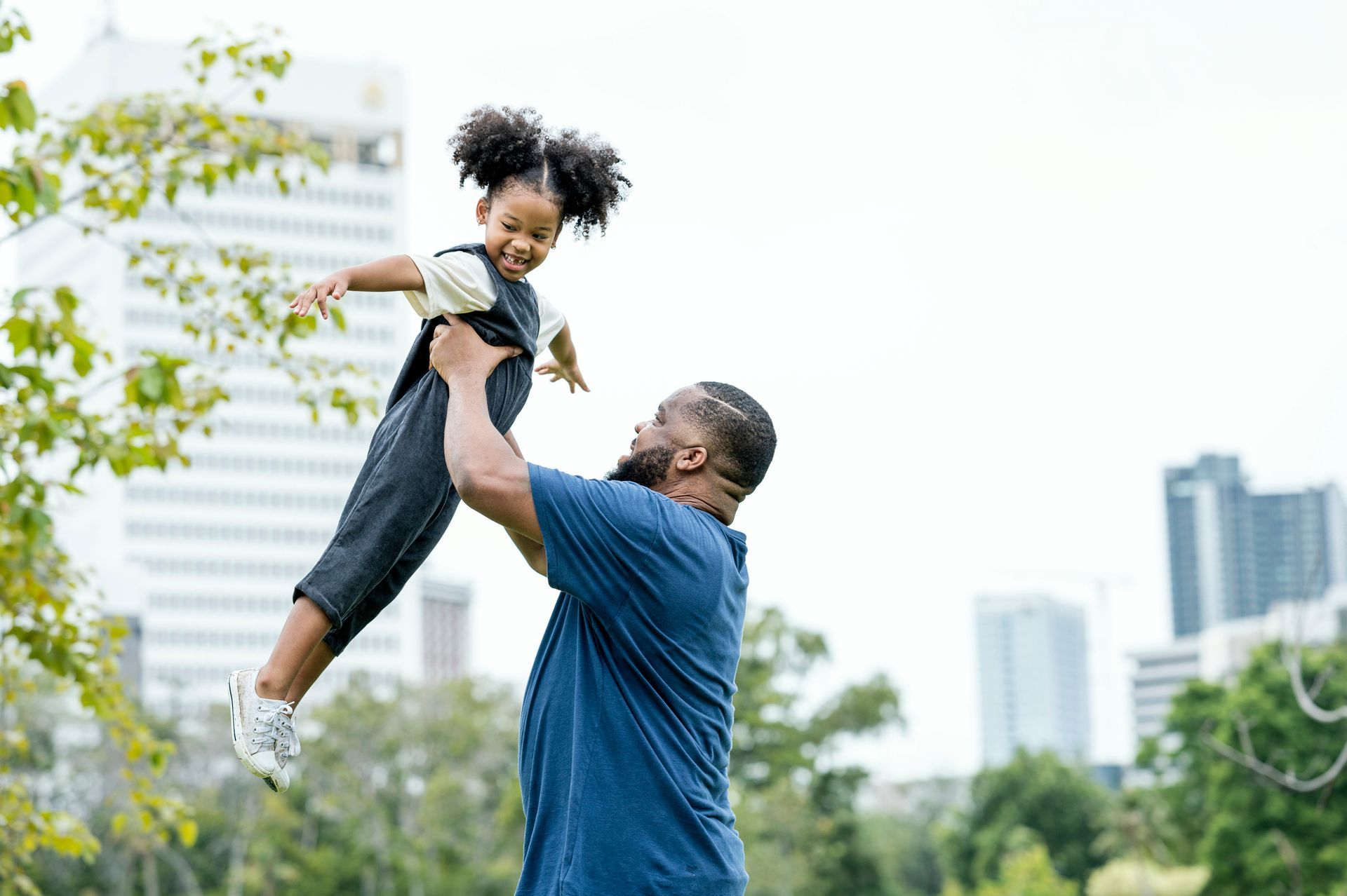Gavel On Family Law Book — Fairlawn, OH — Susan Lax Law Office Father Lifting Daughter Outdoors