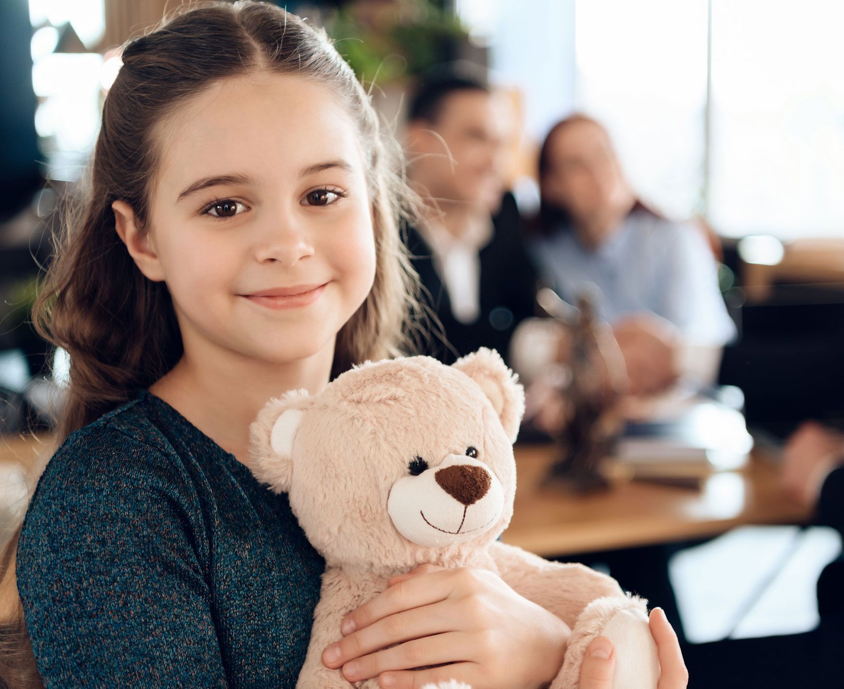 Child Holding Teddy Bear
