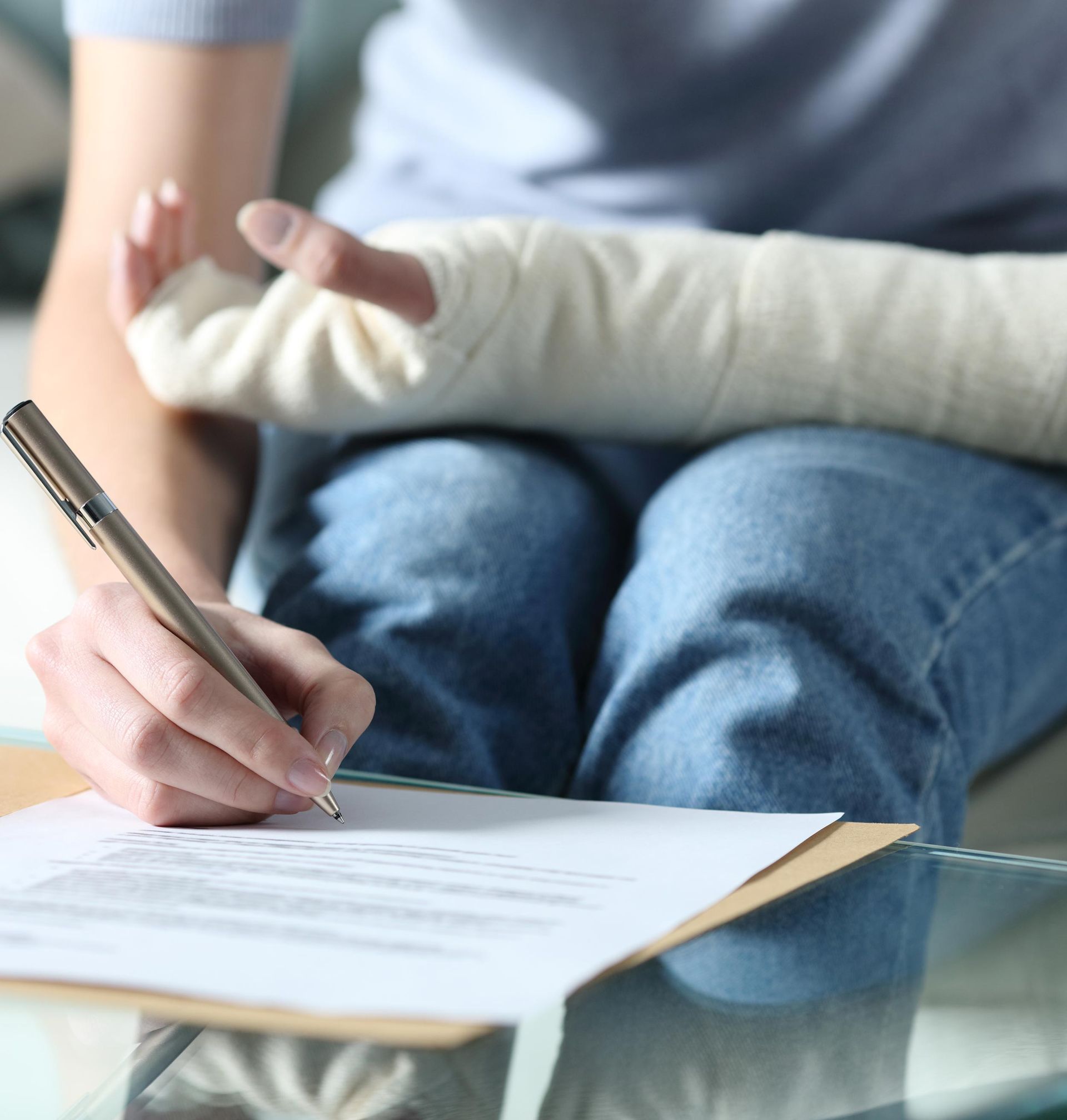 Signing Personal Injury Claims — Fairlawn, OH — Susan Lax Law Office Woman Writing Injury Claim