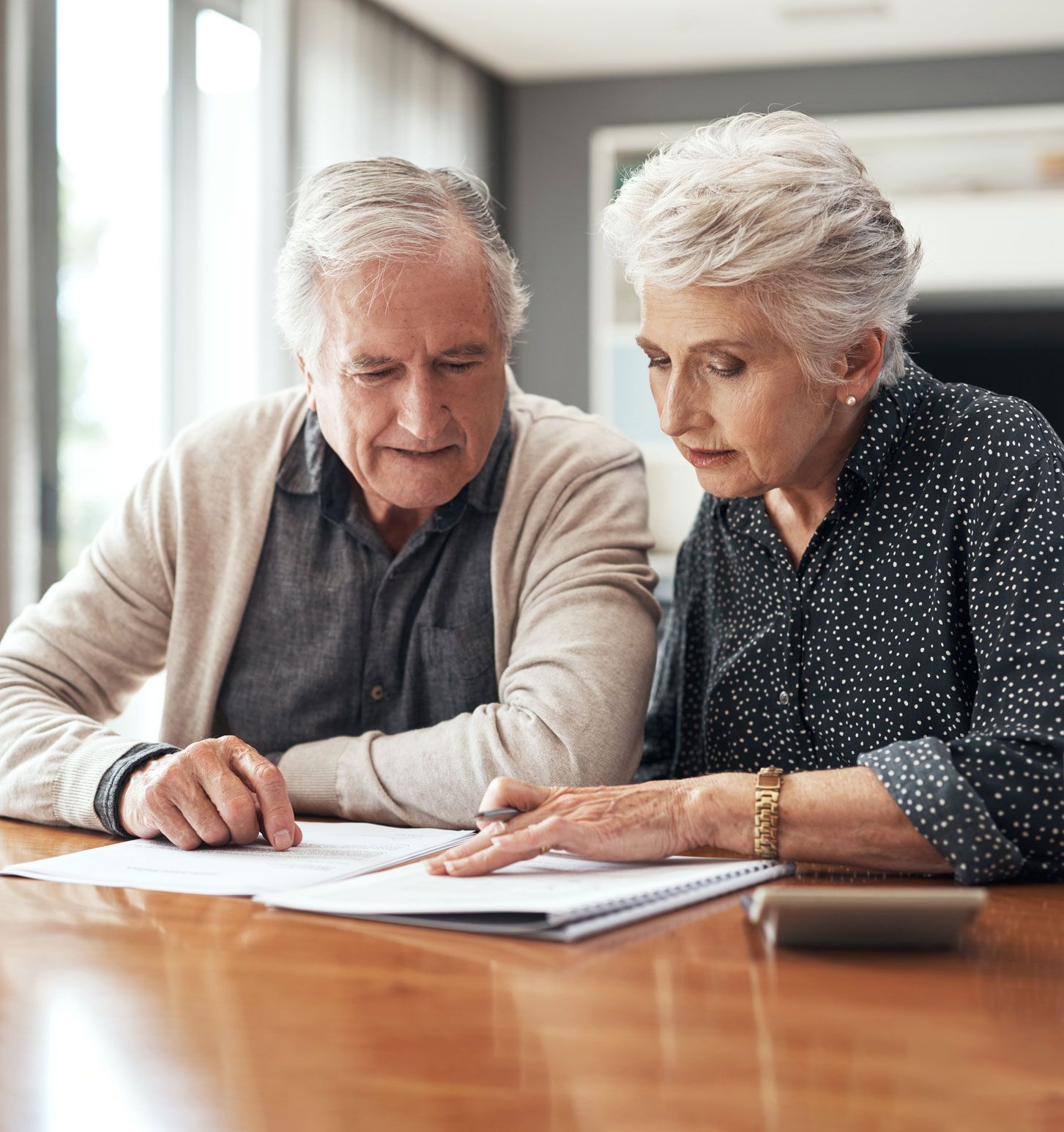 Elder Couple — Fairlawn, OH — Susan Lax Law Office Senior Couple Reviewing Legal Documents