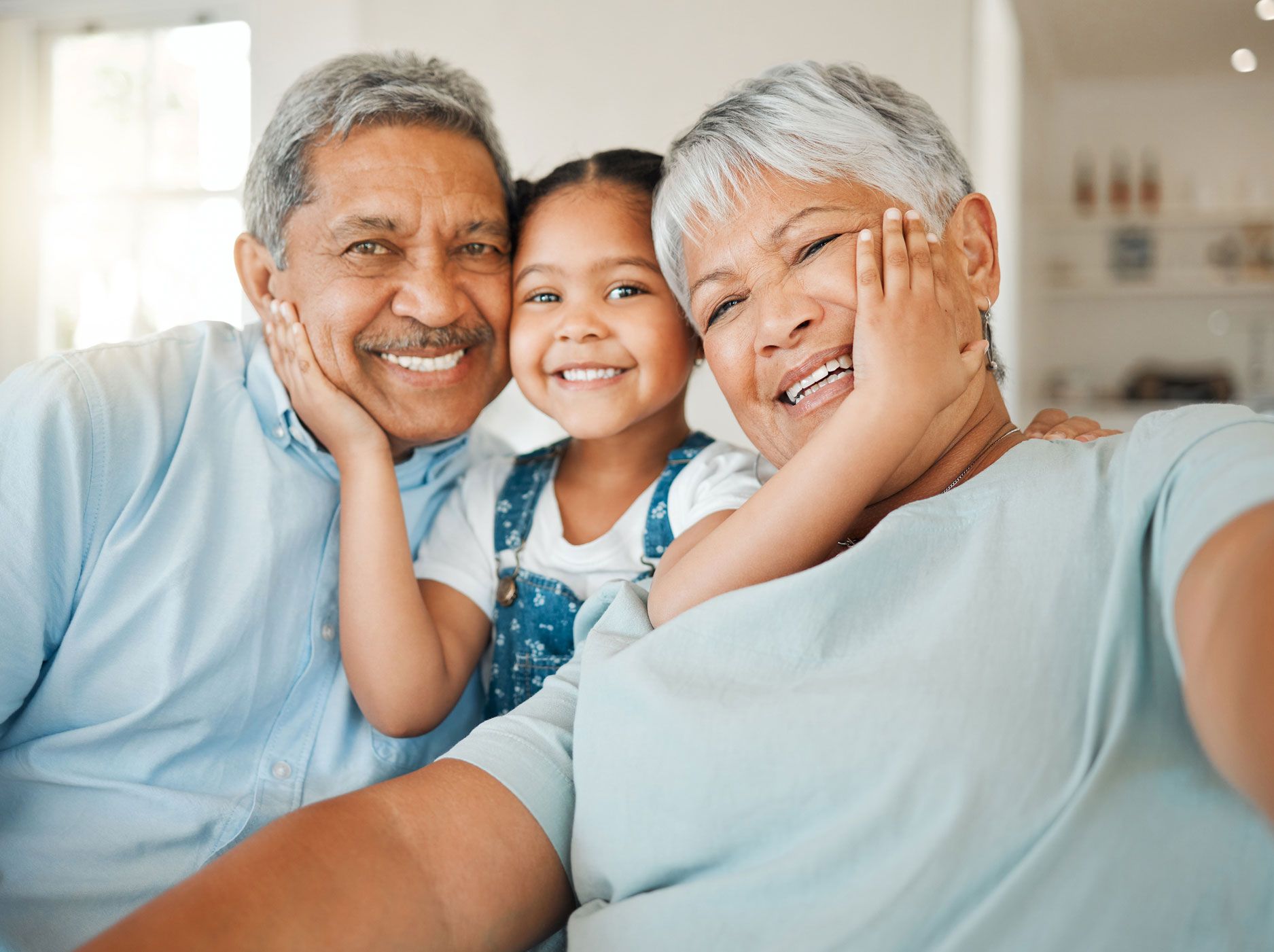 Grandparents With Their Granddaughter — Fairlawn, OH — Susan Lax Law Office Grandparents And Grandchild Smiling