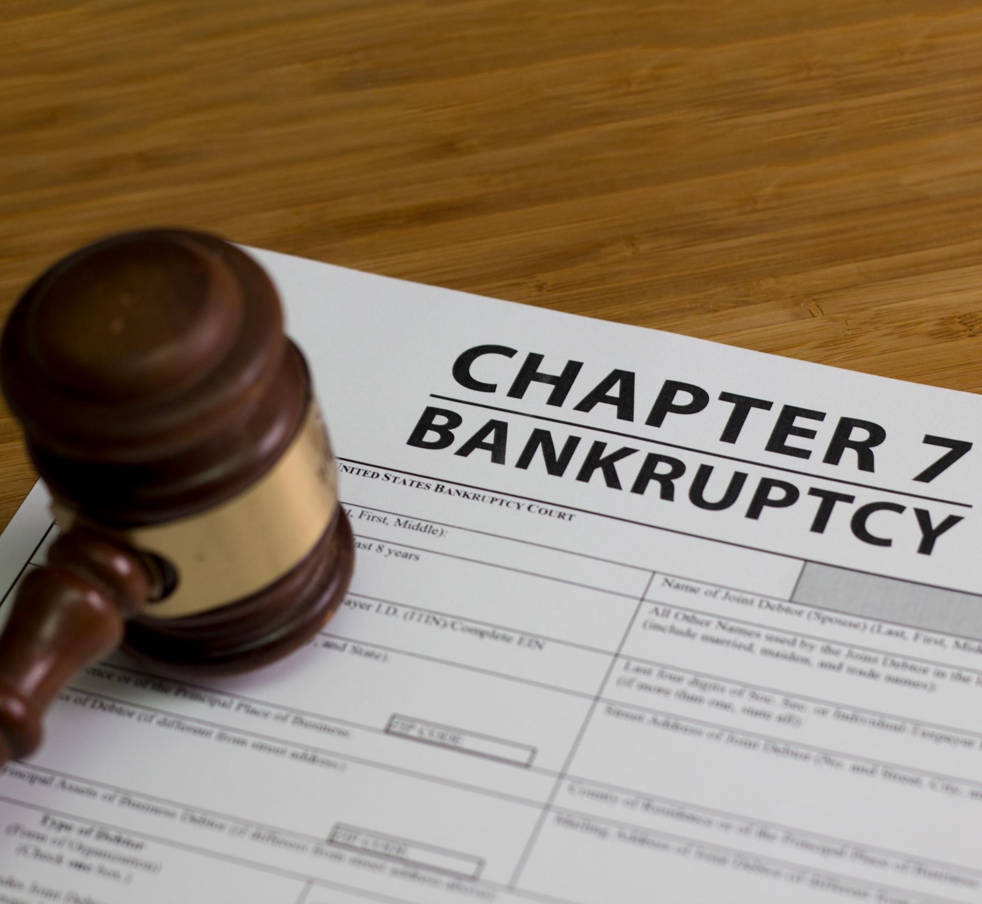 Chapter 7 Bankruptcy Liquidation and a Fresh Start — Fairlawn, OH — Susan Lax Law Office Gavel beside a bankruptcy form labeled “Chapter 7” on a wooden desk
