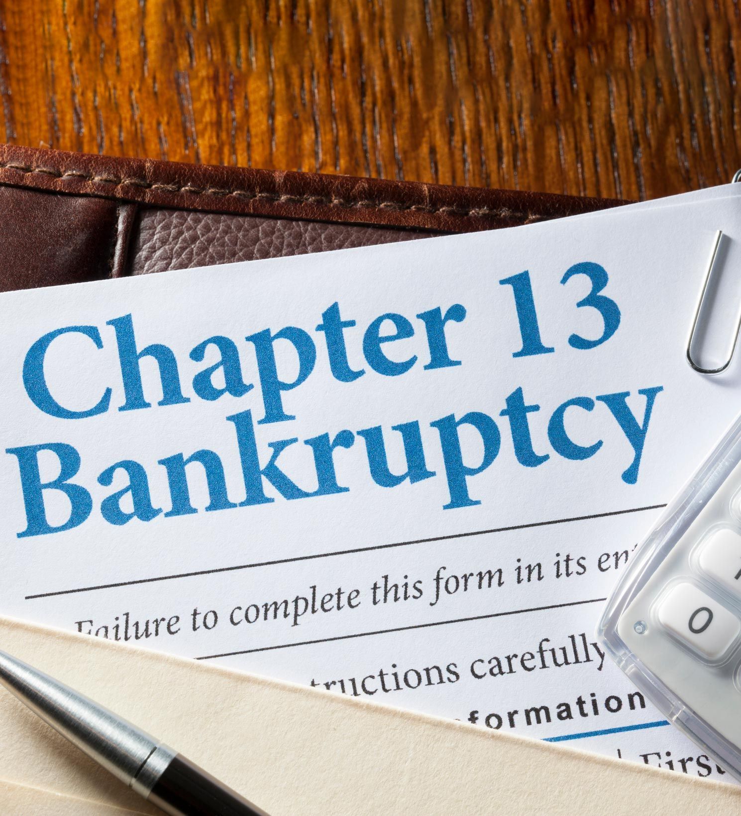 Chapter 13 bankruptcy form on a desk with a pen and paper clips — OH — Susan Lax Law Office Chapter 13 bankruptcy form on a desk with a pen and paper clips