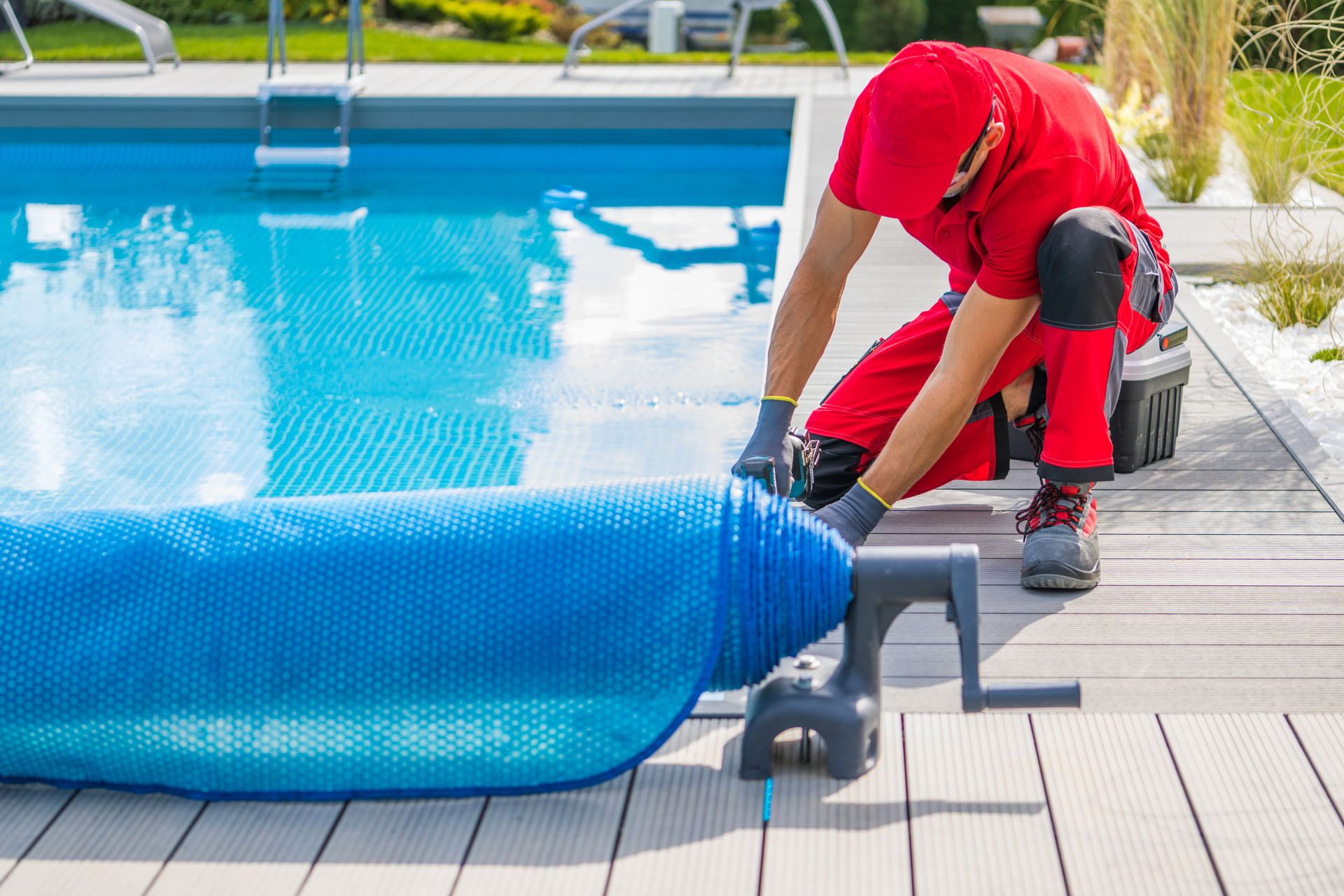 A man is working on a swimming pool.