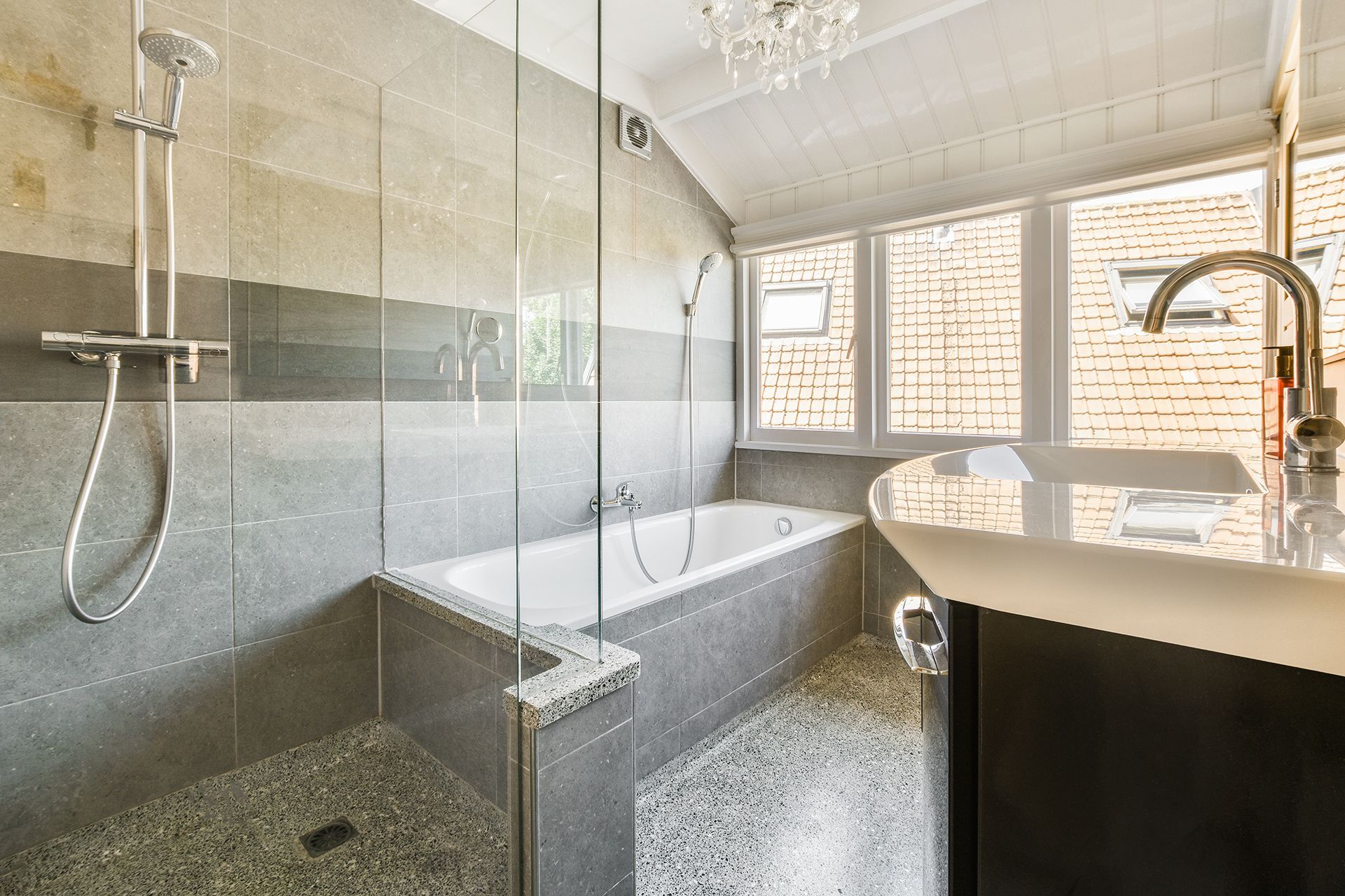 A bathroom with a bathtub and a walk in shower