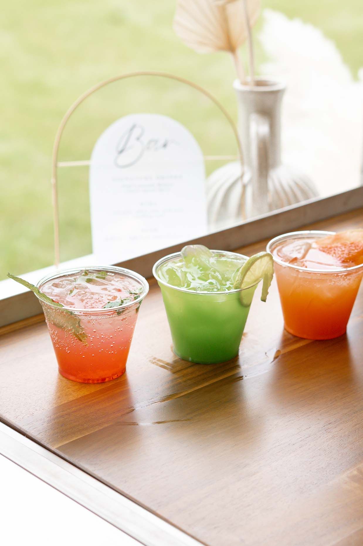 Three colourful drinks