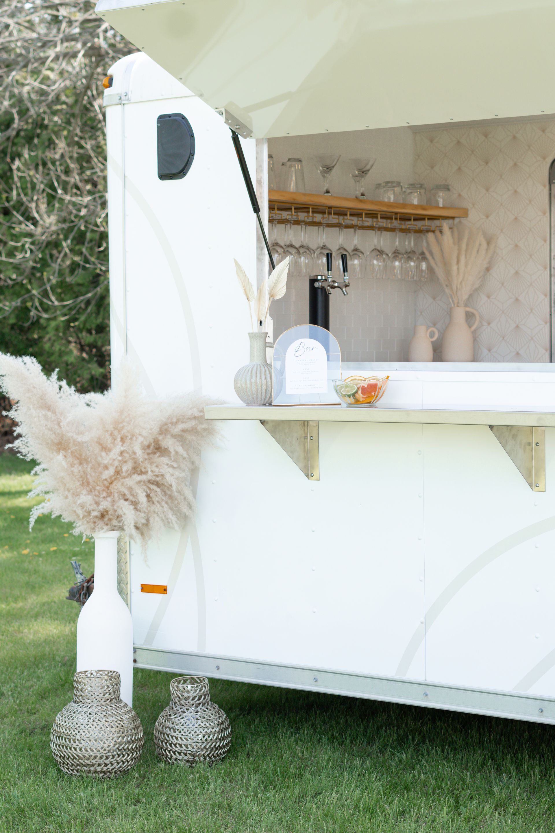Side view of The Cocktail Cart with cute vases and pampas grass