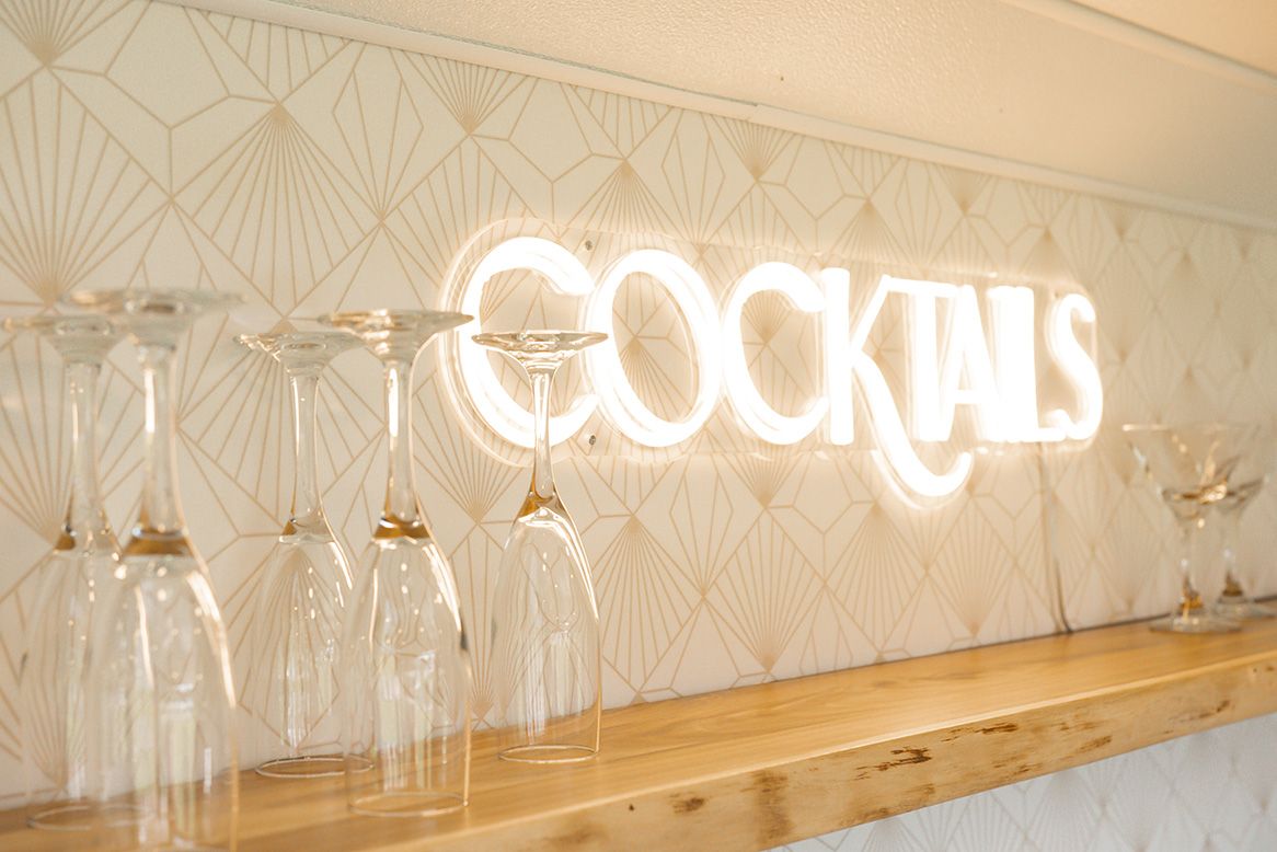 neon sign that says cocktail