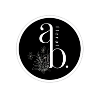 Black circular floral logo with white lowercase “b.” and “floral” text, plus delicate flower line art.