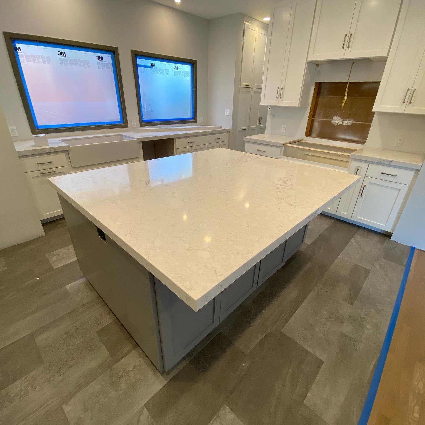 There is a large island in the middle of the kitchen.