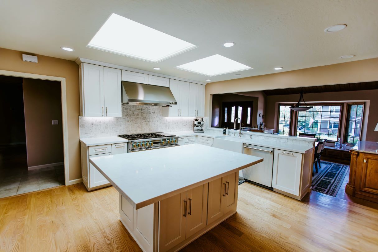 There is a large island in the middle of the kitchen.