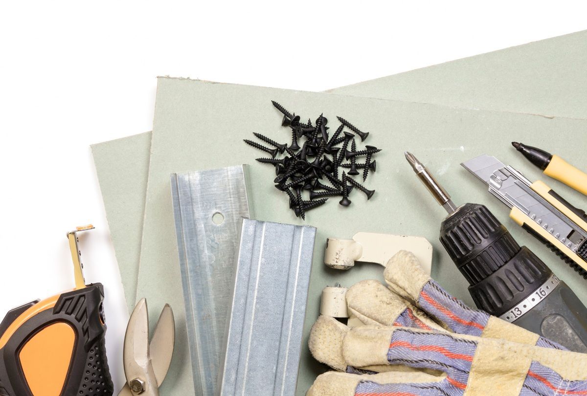 Professional drywall tools and equipment used by a technician in Porterville, CA