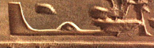 A close up of a statue with arabic writing on it