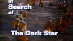 A group of people are walking in the dark with the words in search of the dark star