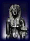 A black and white photo of a statue of a woman holding a torch.