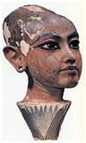 A close up of a statue of a woman 's head on a white background.