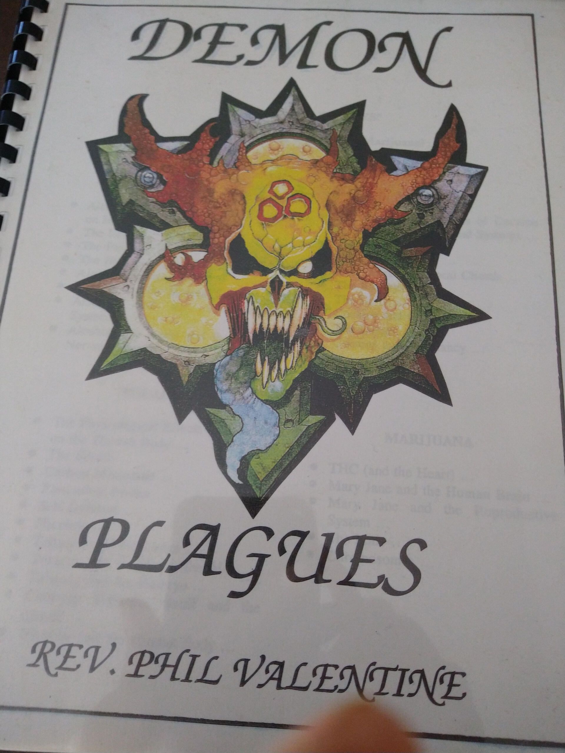 A book titled demon plagues by rev phil valentine