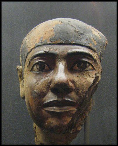A close up of a statue of a man 's face