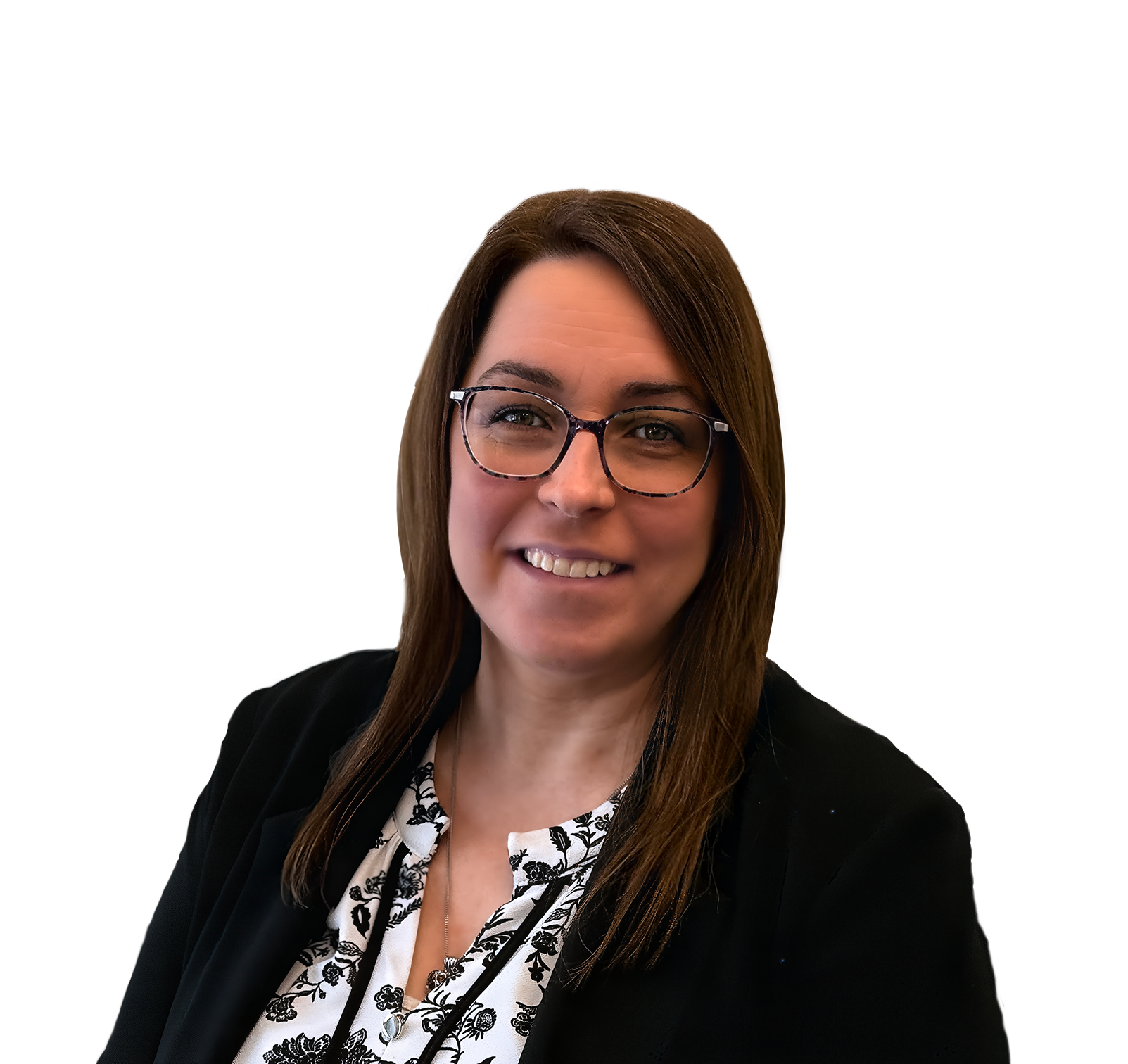 Smiling woman with glasses in black blazer and patterned blouse on a white background