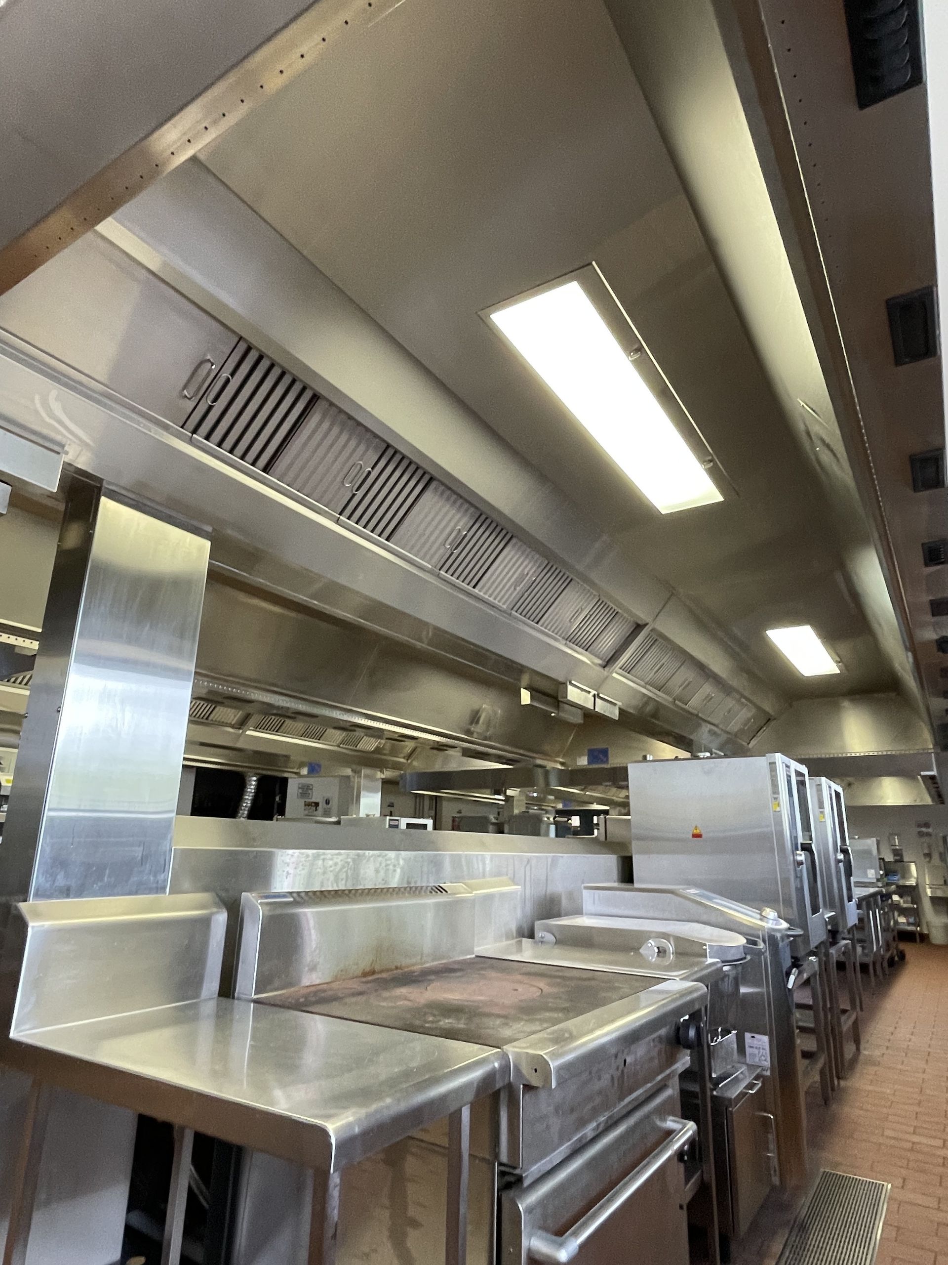 A Kitchen Stainless Steel Appliances, Pots and Pans From the Ceiling — DM & MM Services Pty Ltd in Mount Louisa, QLD