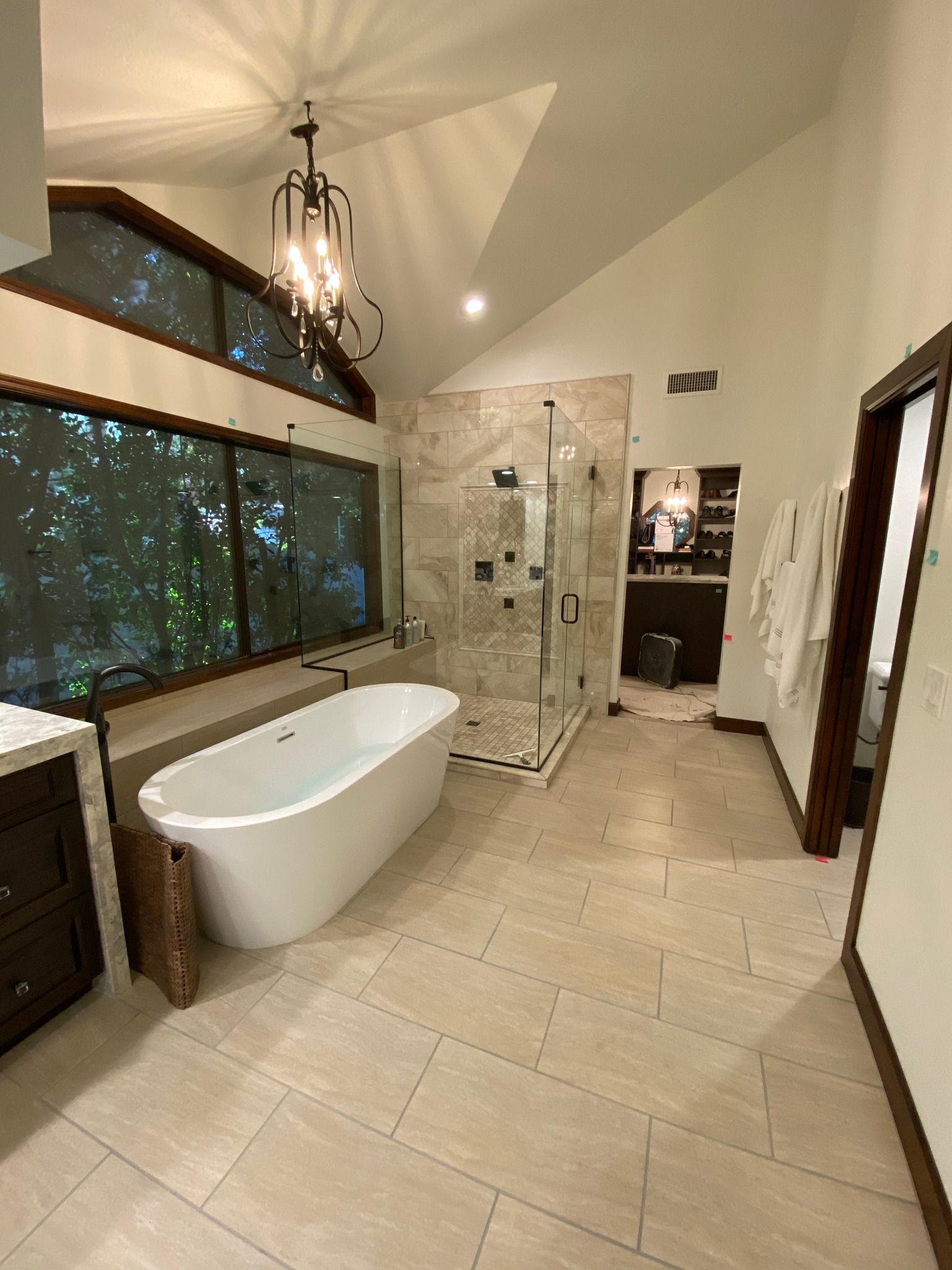 A bathroom with a bathtub and a walk in shower.