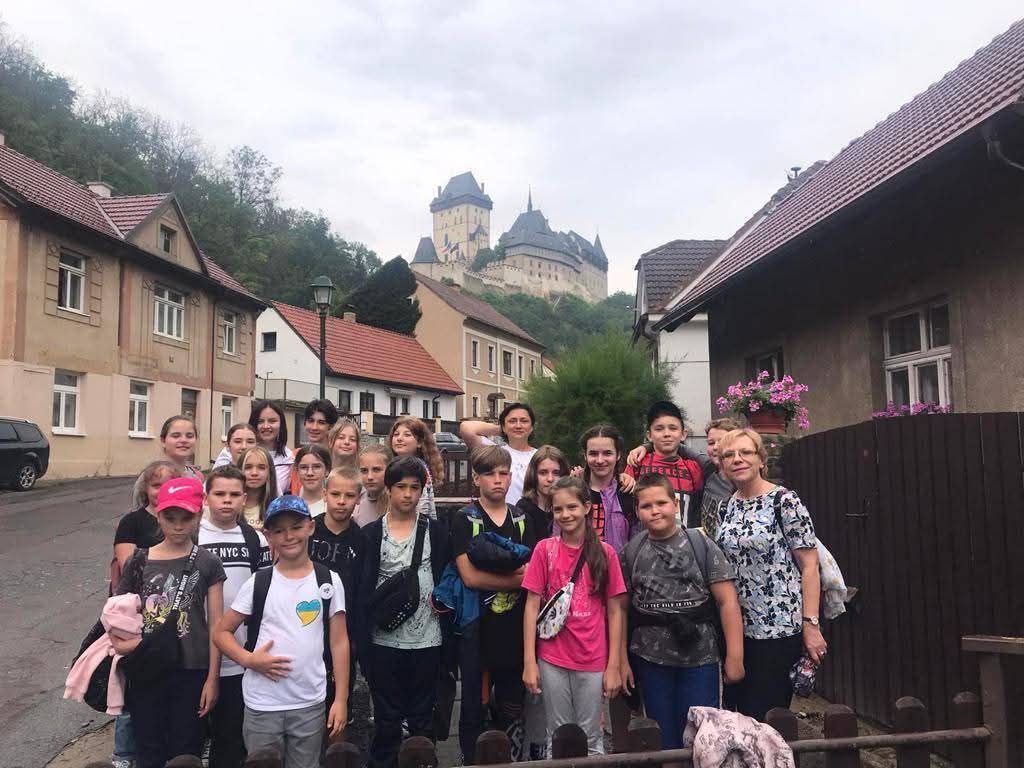 Group on a bespoke private walking tour of Prague Old Town at sunrise