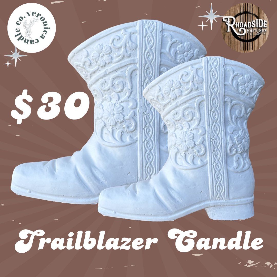 White embroidered Trailblazer Candle boots on a brown background, priced at $30.