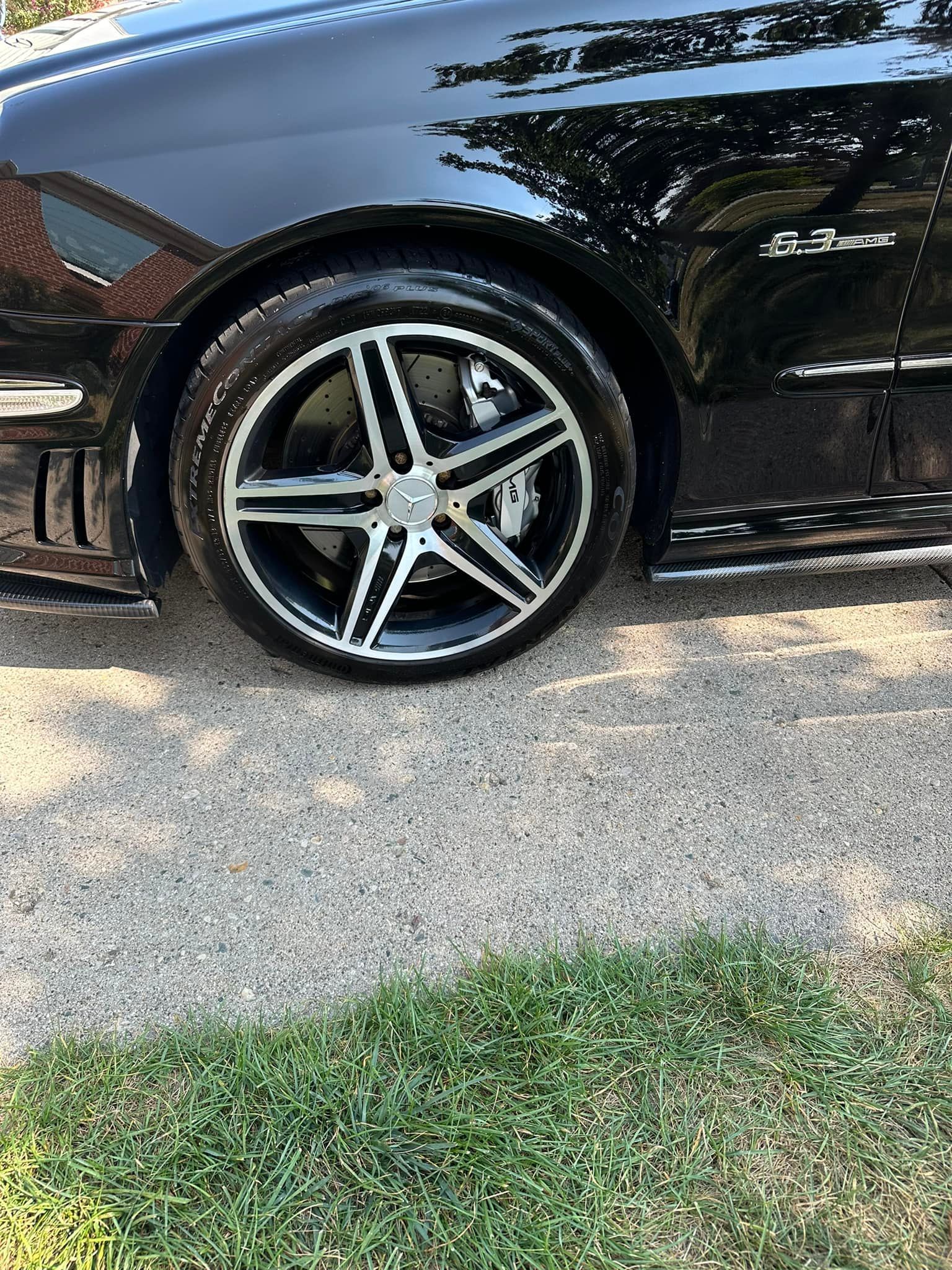 Black car wheel with silver and black spoke design.