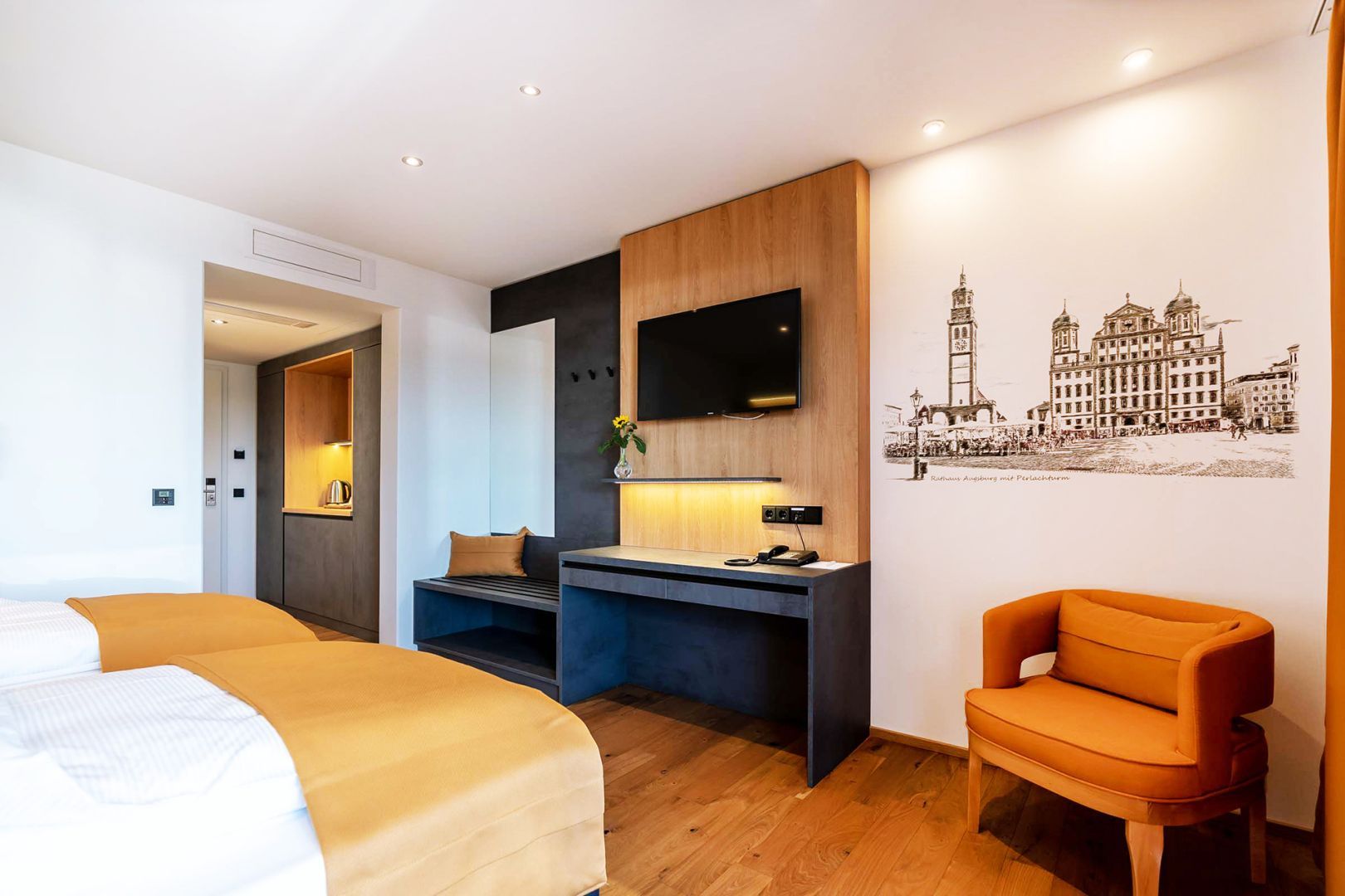 ett historiskt stadsmotiv tryckt direkt på väggen i ett hotellrum, med hjälp av Verticalis innovativa skrivarteknik