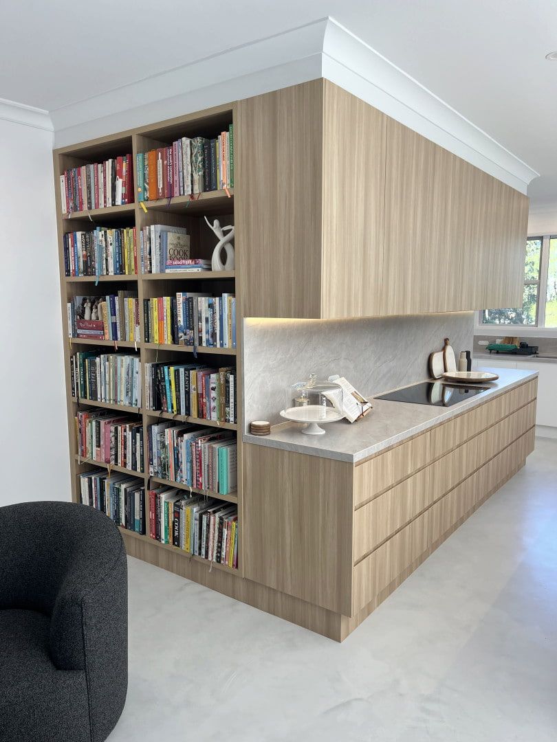 Built-in Bookshelf and Wood Cabinetry in a Bright Modern Kitchen — JDS Kitchens & Detailed Joinery in Albion Park Rail, NSW