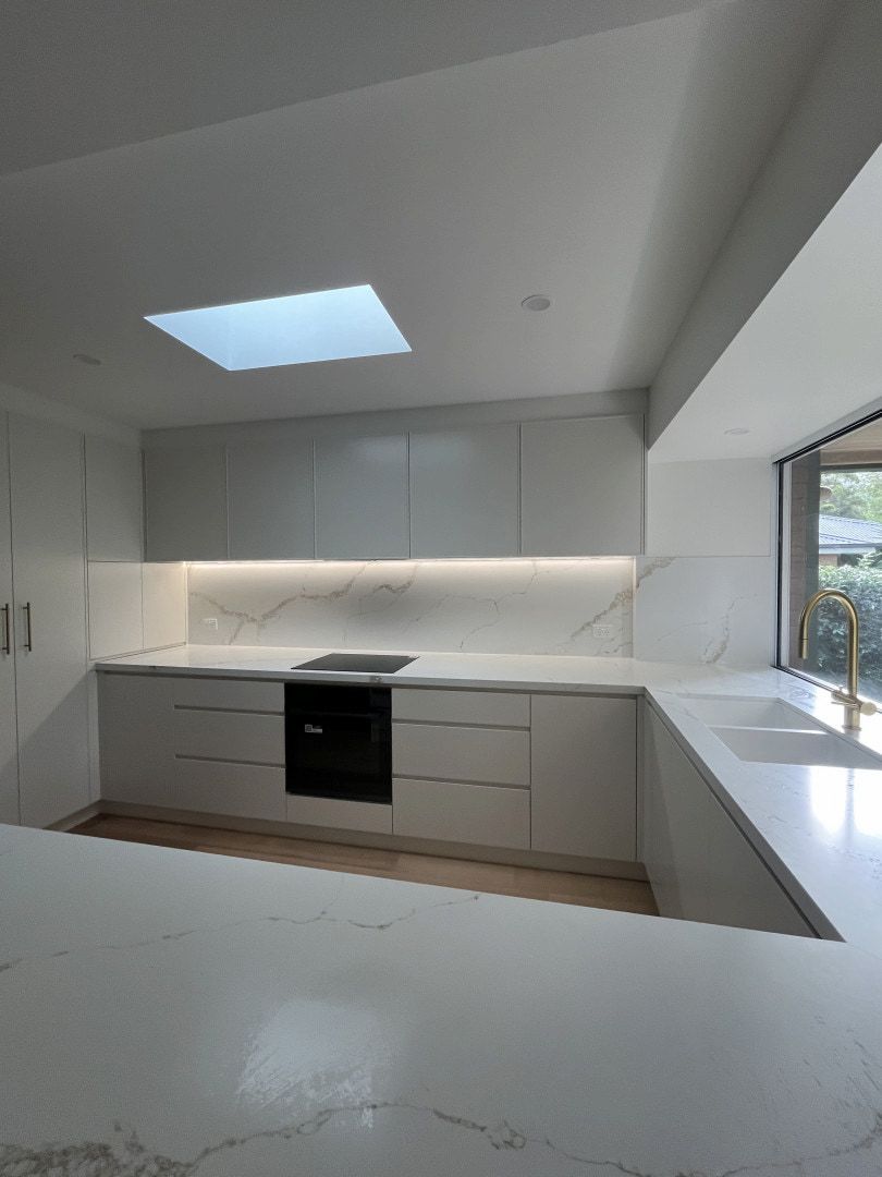 Modern White Kitchen With Gray Cabinets, Marble Backsplash — JDS Kitchens & Detailed Joinery in Albion Park Rail, NSW